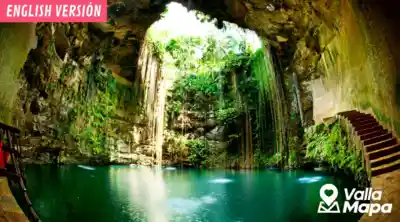 Cenote Pueblo Fantasma near Chemax with turquoise water and jungle greenery