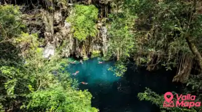 Cenote near Valladolid with clear water, stone walls and swimming access