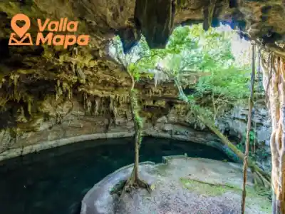 Clear blue cenote near Valladolid Yucatán with natural limestone surroundings