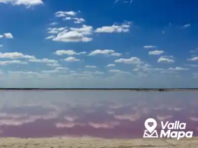 Pink water at Las Coloradas in Yucatan with salt flats and bright sky