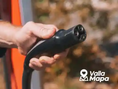 Tesla electric vehicle connected to a charger during a Valladolid travel stop
