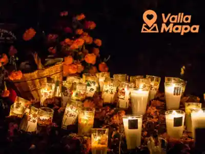 Hanal Pixán altar in Yucatán with candles, flowers and traditional food