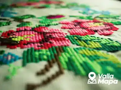 Yucatecan embroiderer working on colorful floral embroidery for a hipil or terno