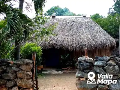 Traditional Maya house in Yucatan with huano roof and shaded outdoor area
